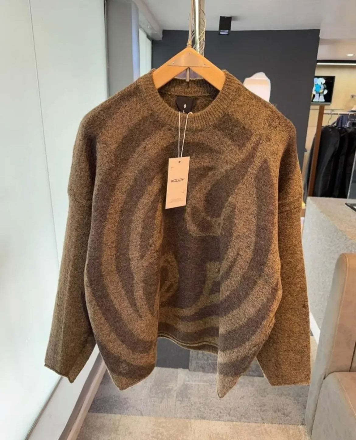 “Swirl Distortion Knit” Sweater
