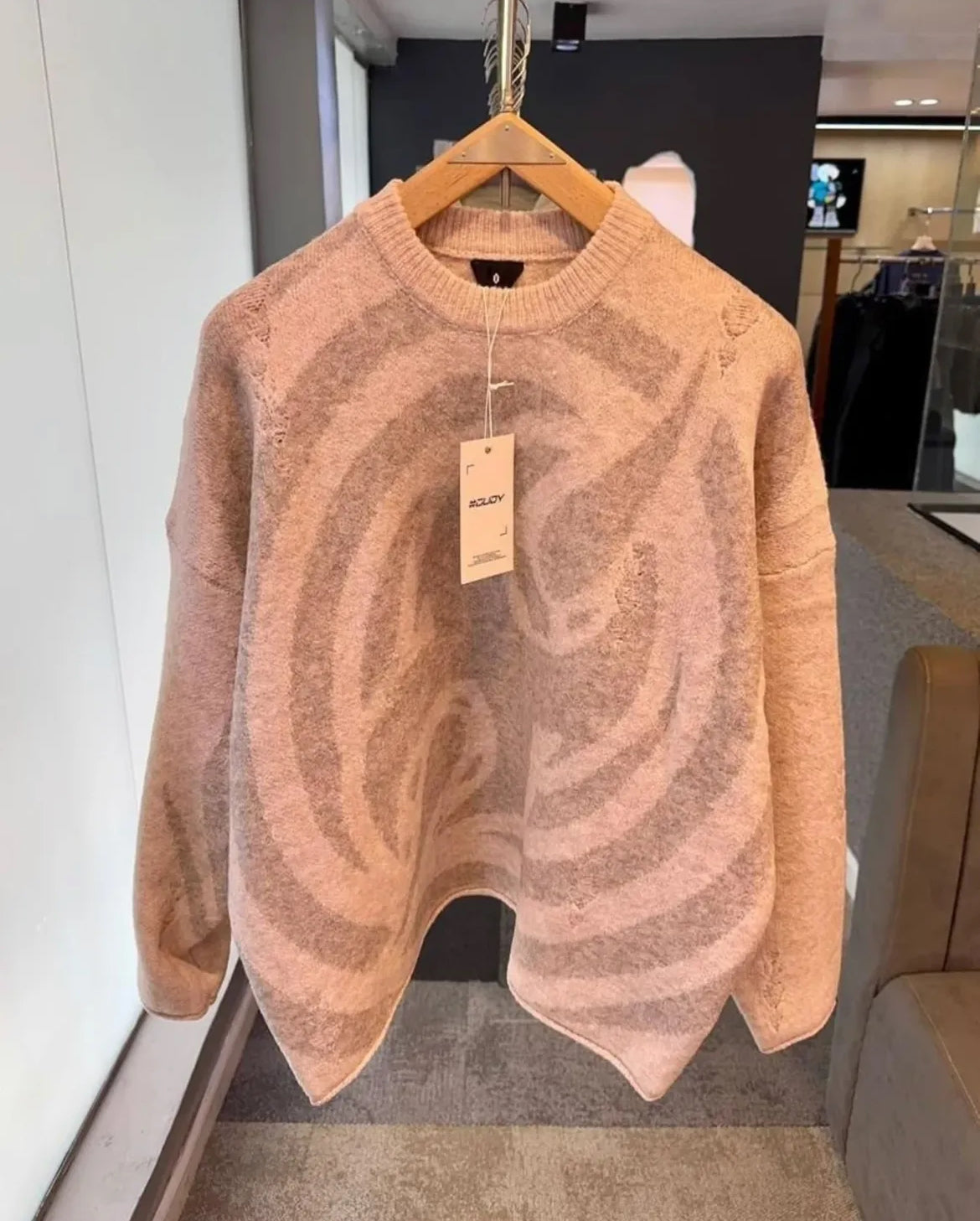 “Swirl Distortion Knit” Sweater